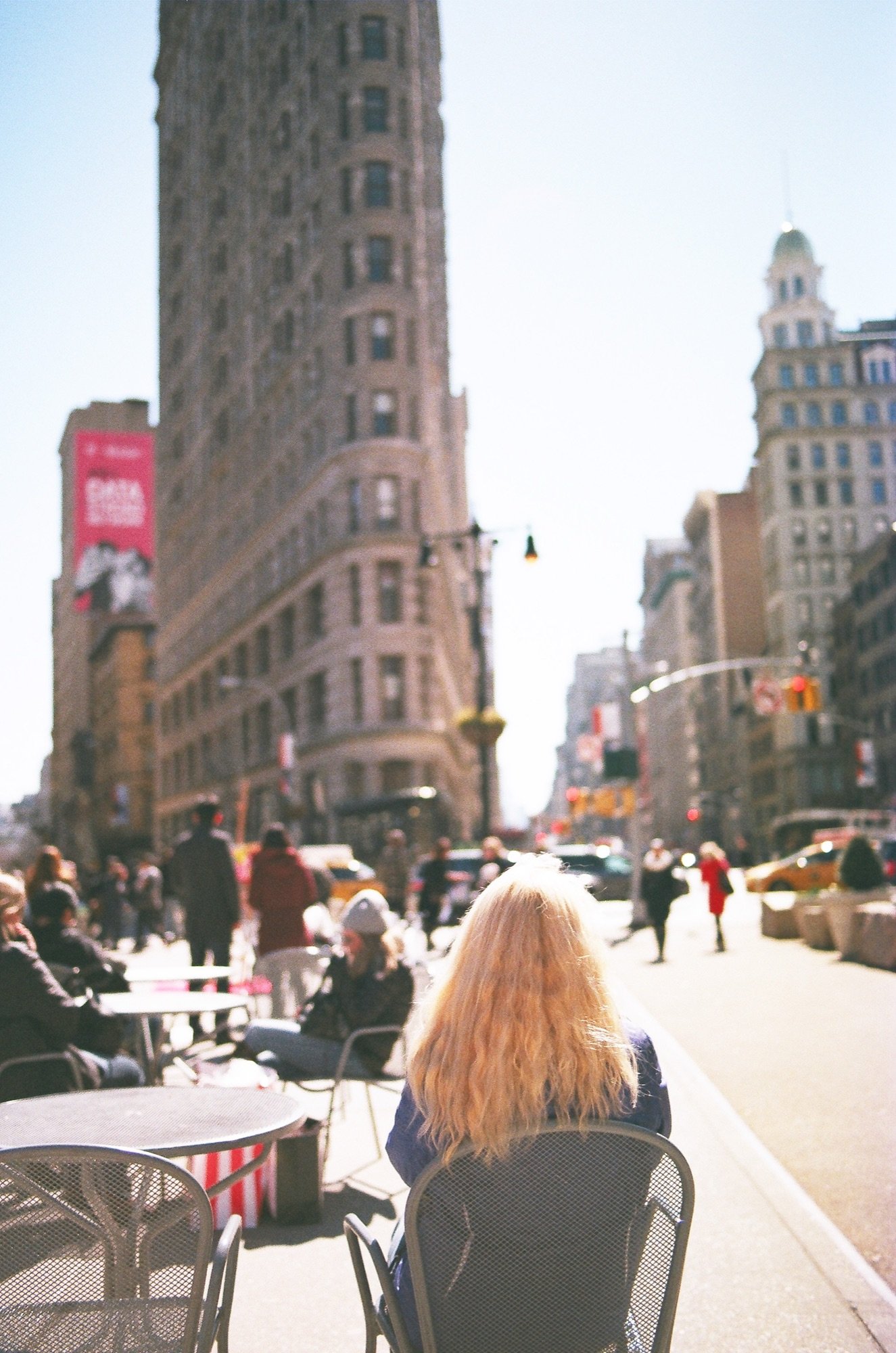 A woman facing the Flatiron building