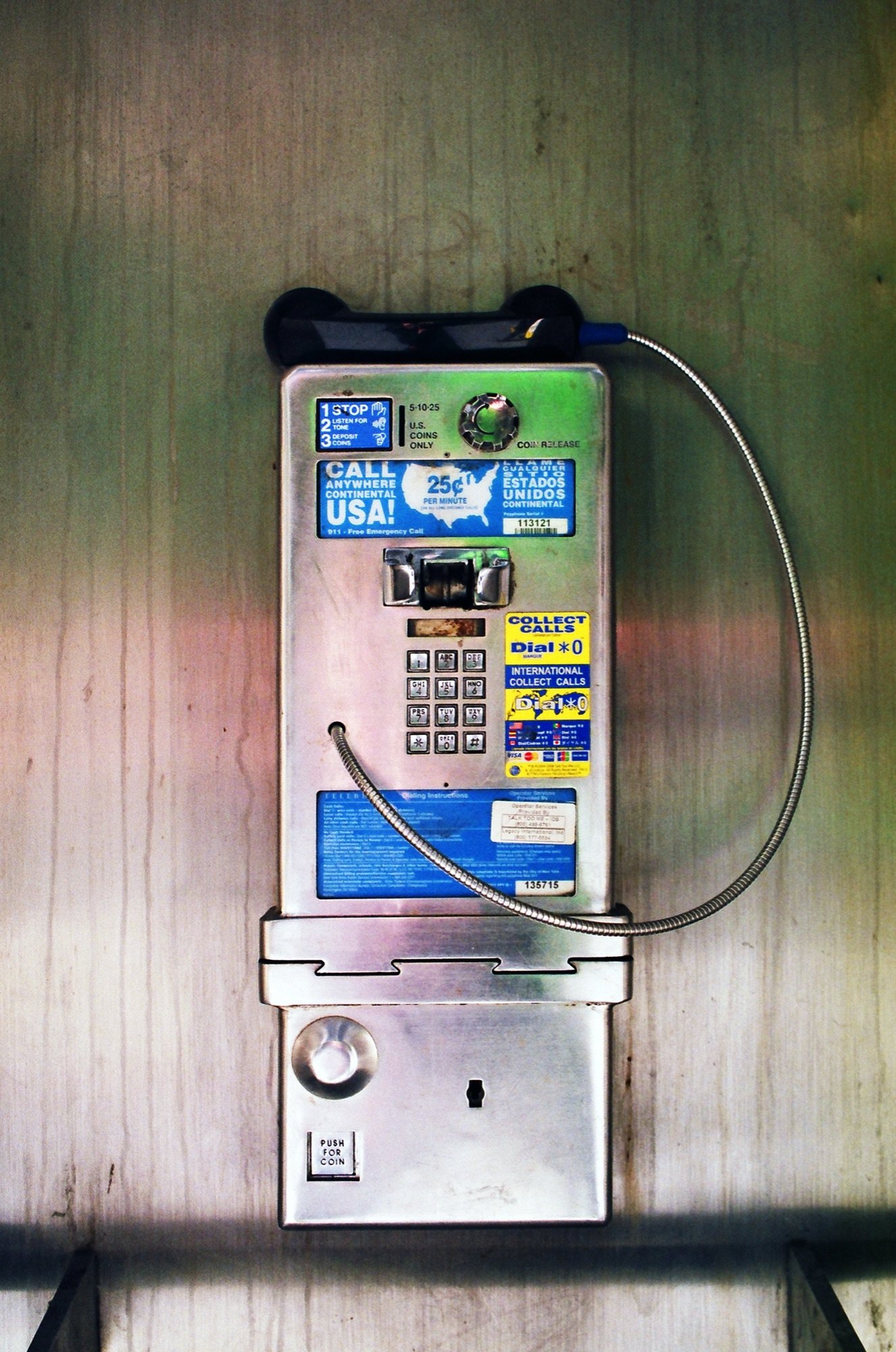 A vintage payphone in a booth