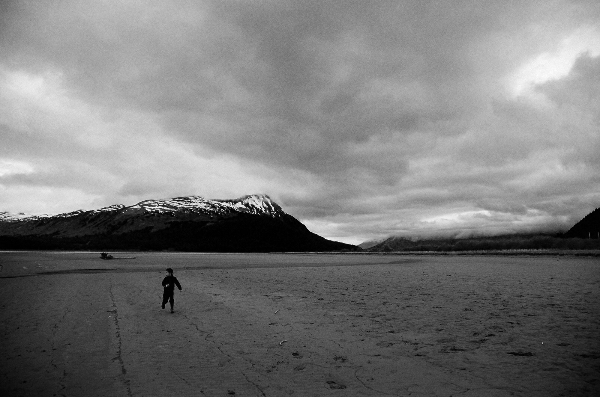 A child running across a tidal flat