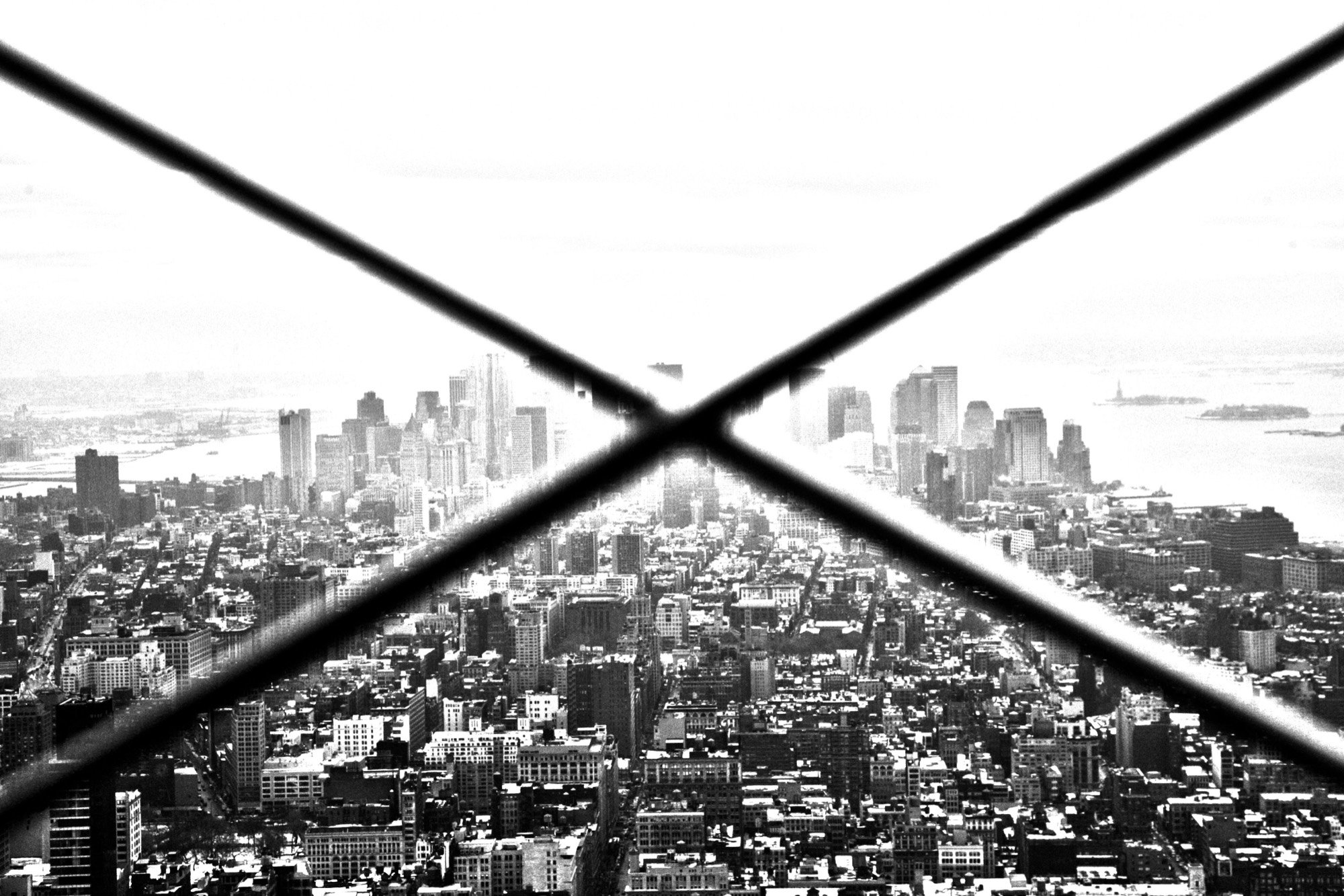 Lower Manhattan seen through observation-deck mesh