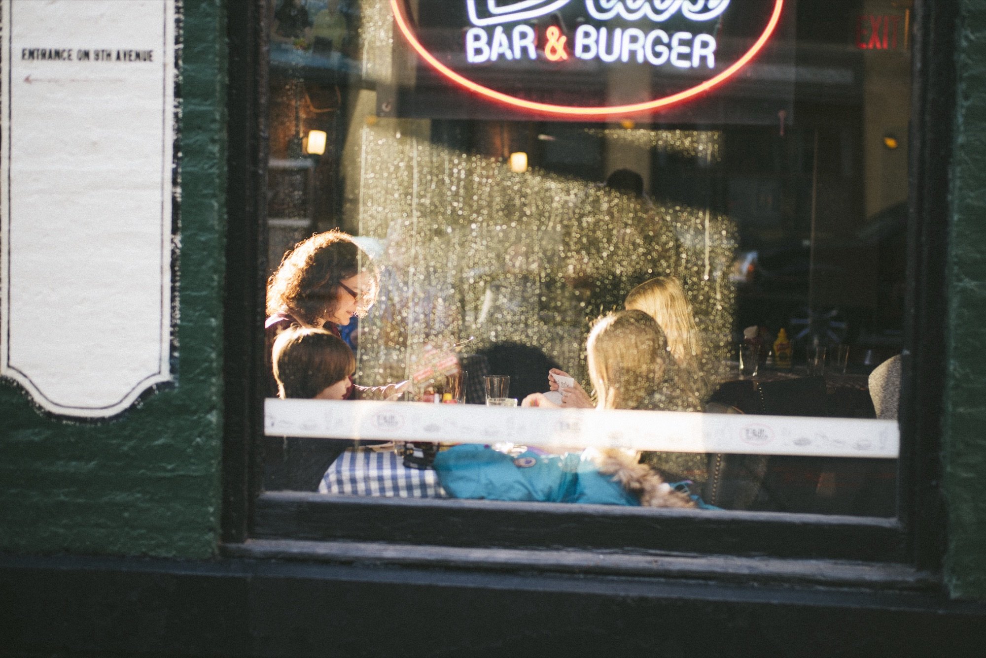 Diners seen through a cafe window