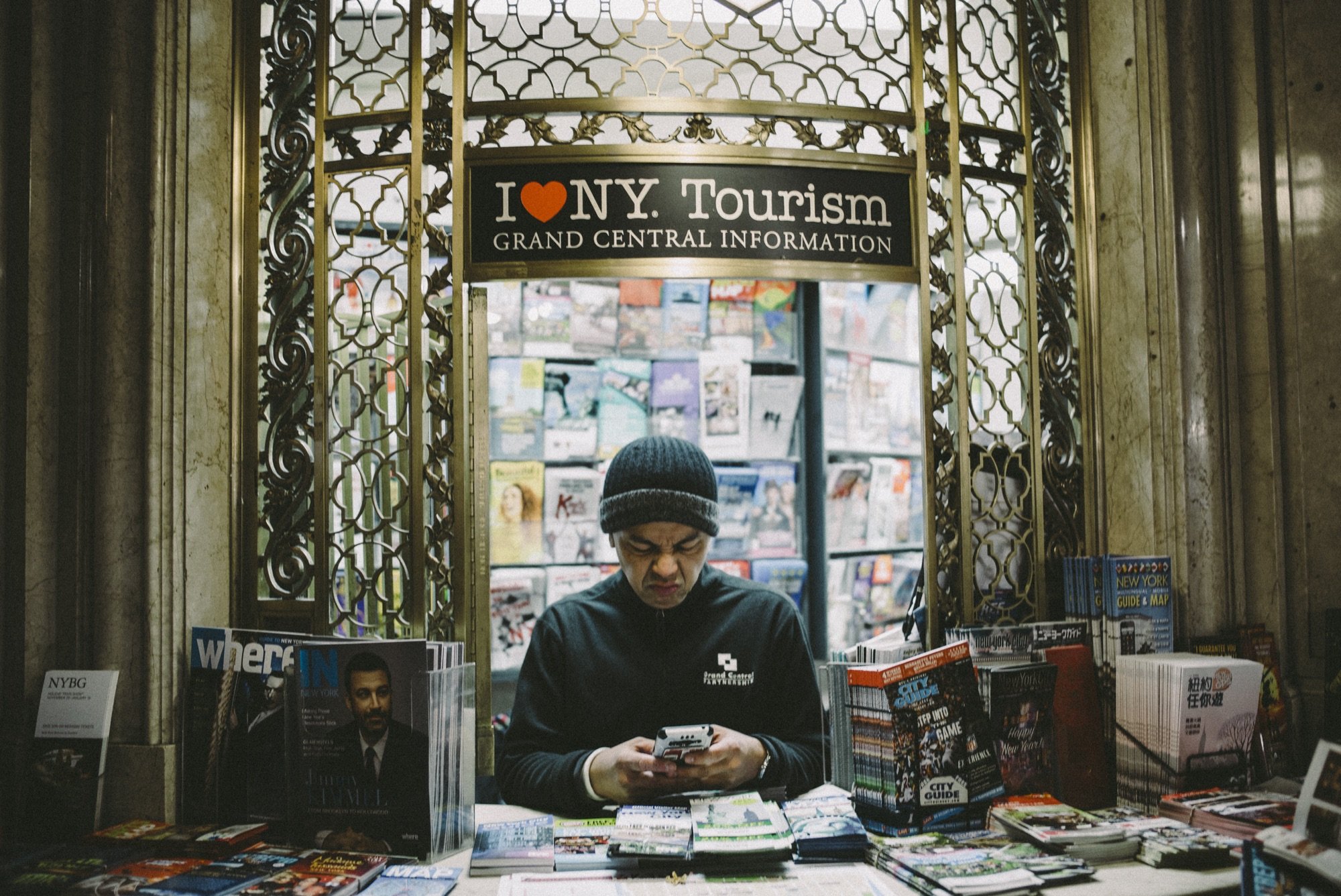 A man at a tourism information booth