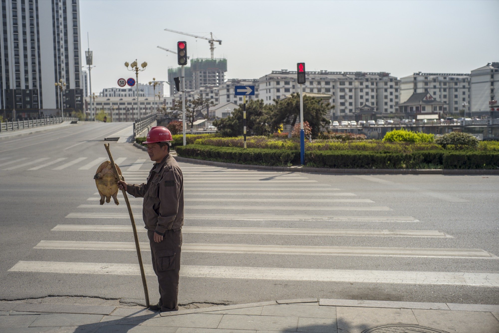 A street sweeper standing at an empty crosswalk