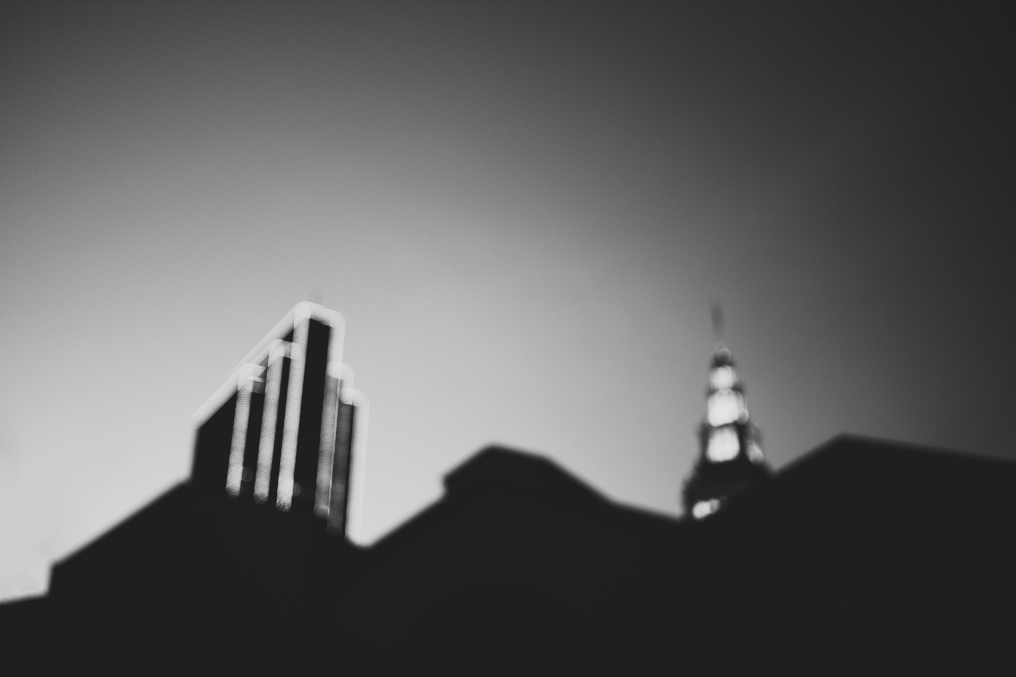 A soft-focus city skyline in black and white