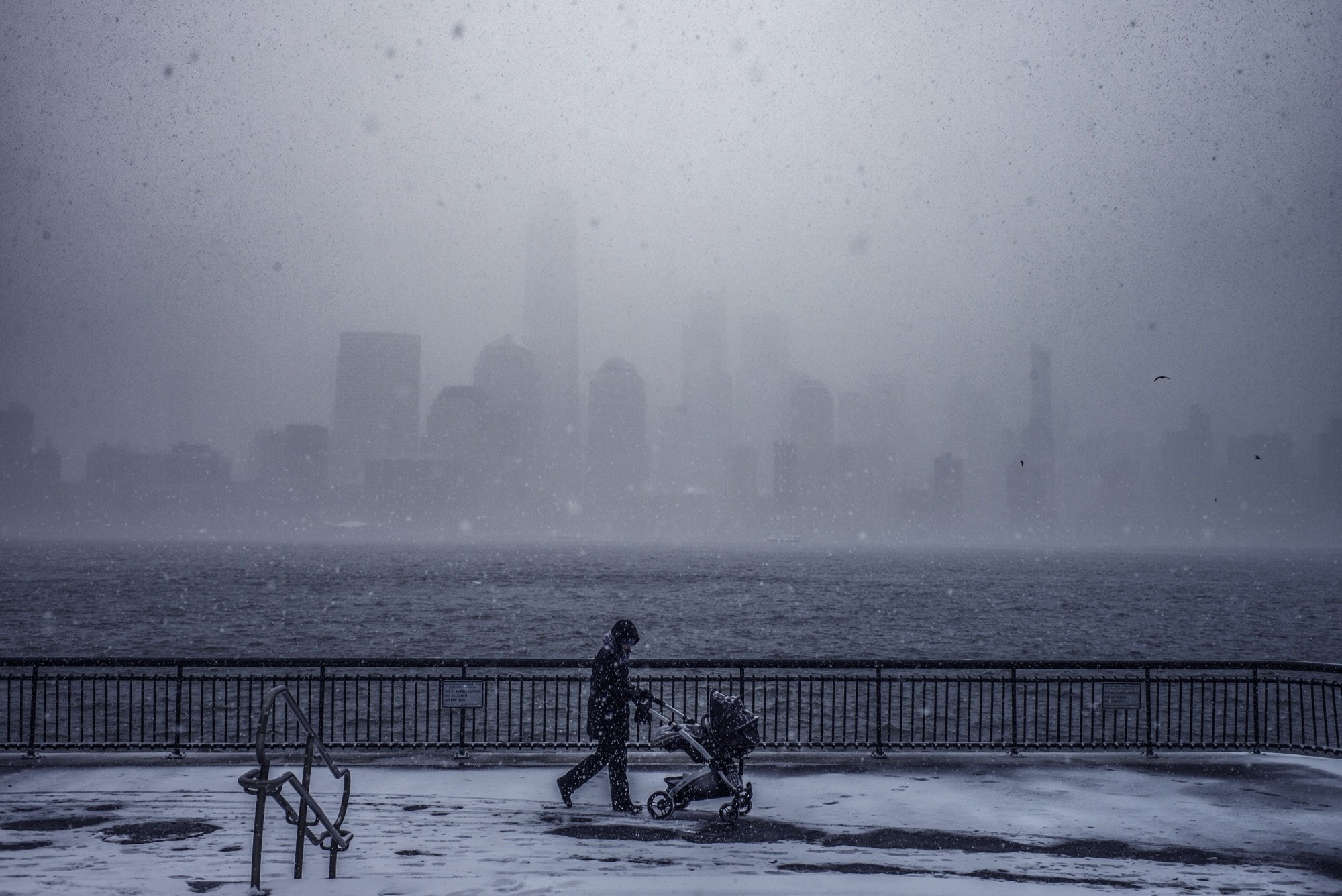 A lone walker in a snowstorm
