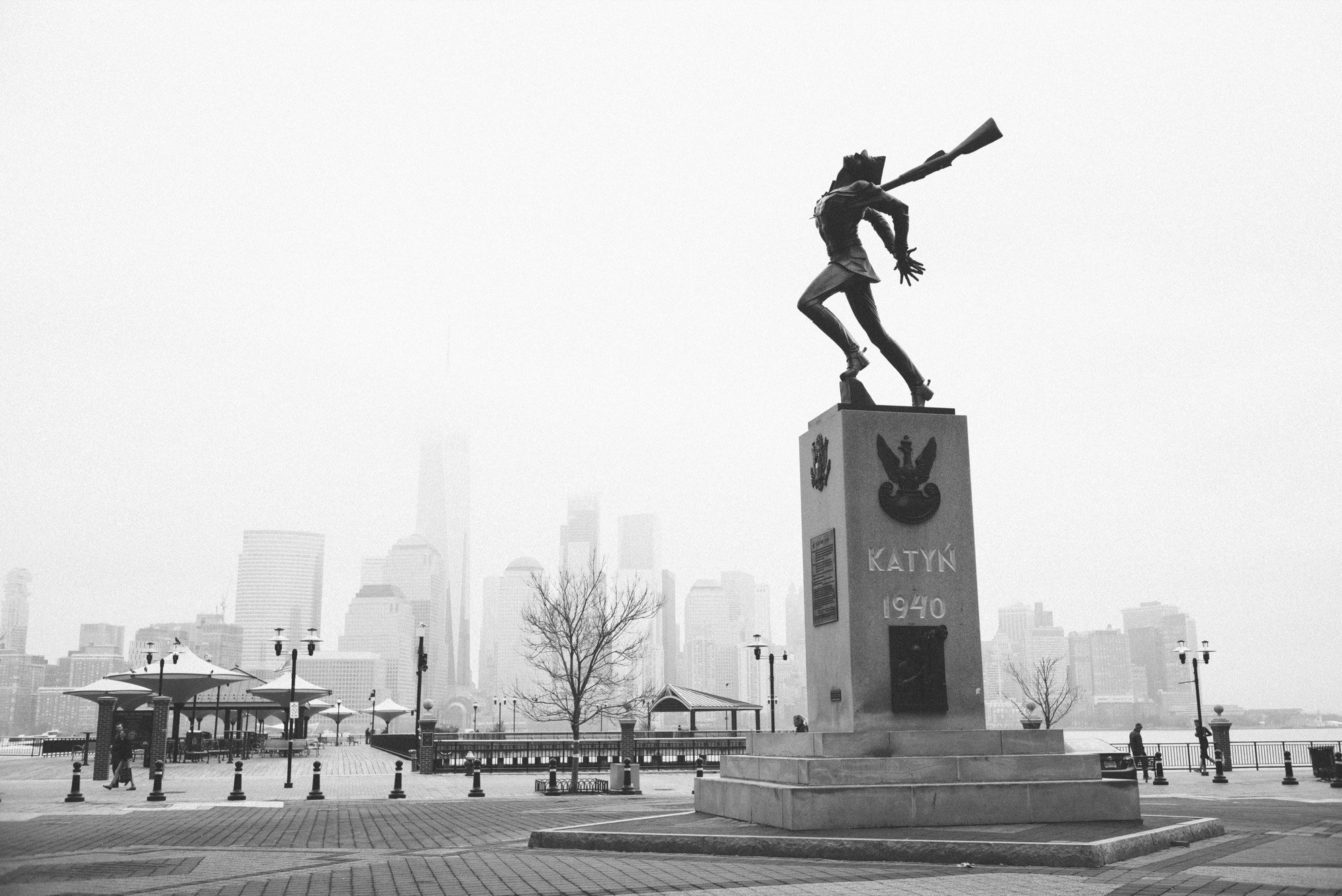 A memorial statue before a misty skyline