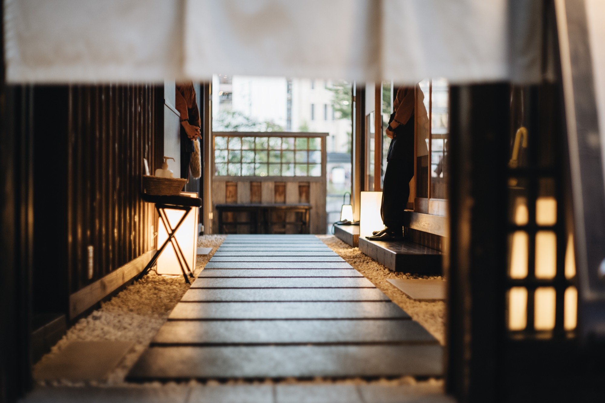 A warmly lit traditional Japanese entryway